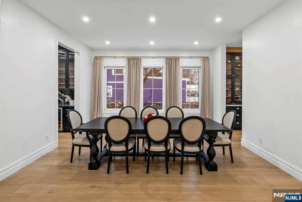 472 High Street Closter, NJ 07624 - Photo 17 of 34 a view of a dining room with furniture wooden floor and chandelier