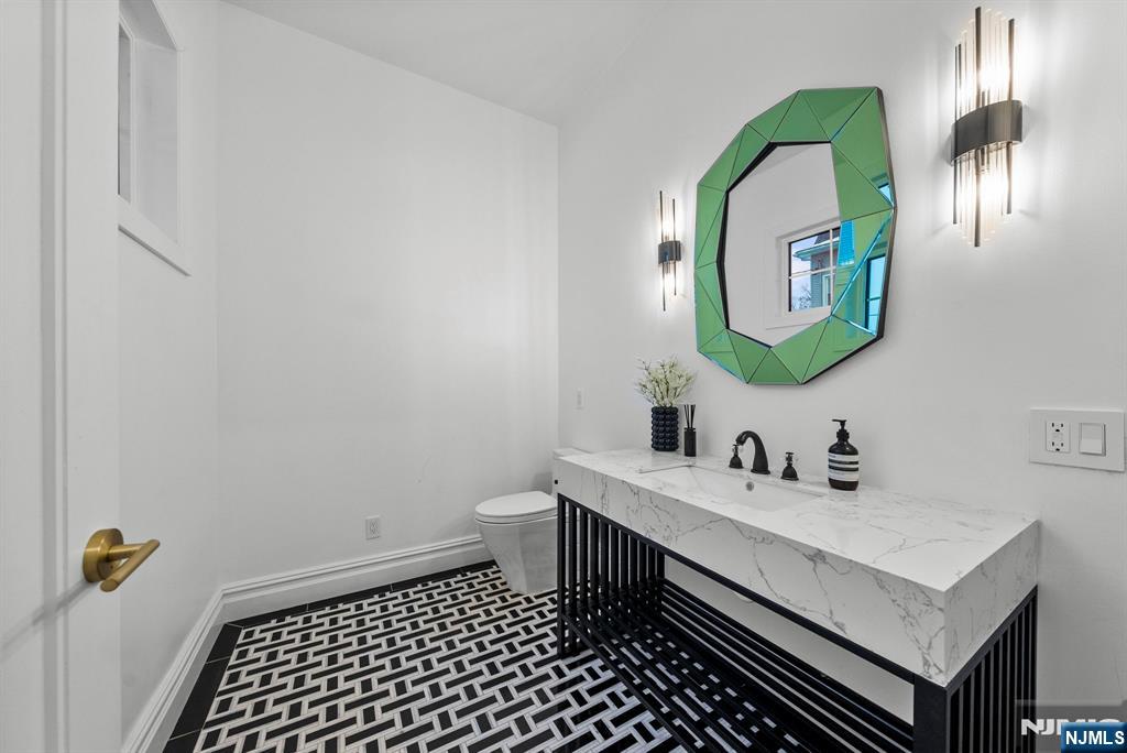 472 High Street Closter, NJ 07624 - Photo 26 of 34 a bathroom with a sink and a mirror