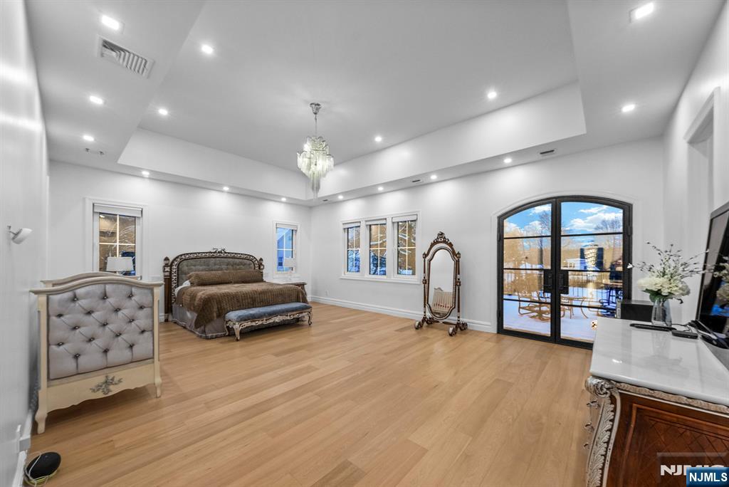 472 High Street Closter, NJ 07624 - Photo 30 of 34 a living room with furniture gym equipment and a flat screen tv