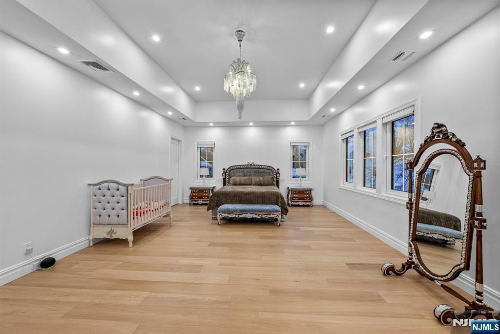 472 High Street Closter, NJ 07624 - Photo 31 of 38 a room with gym equipment and a chandelier