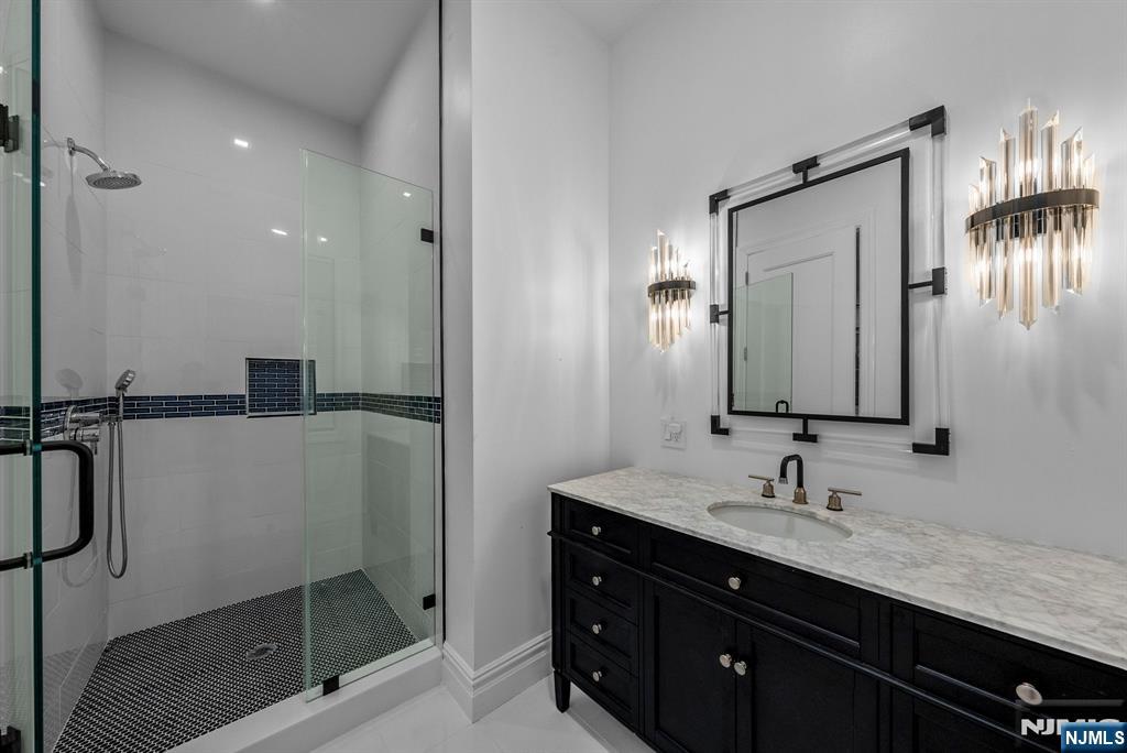 472 High Street Closter, NJ 07624 - Photo 5 of 34 a bathroom with a sink and a mirror