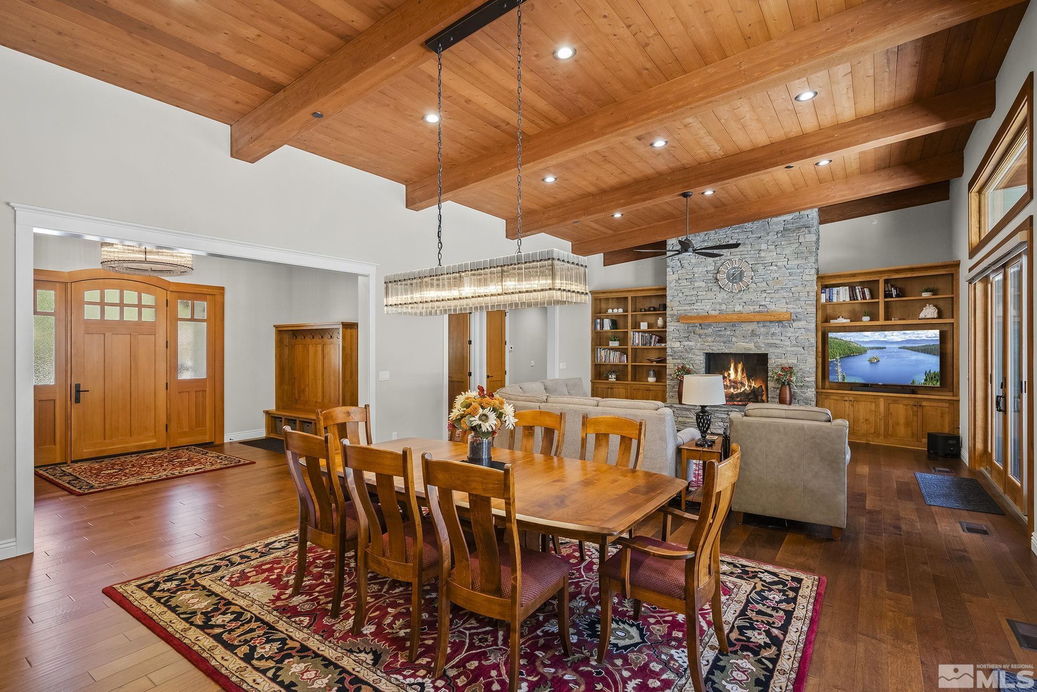 119 Five Creek Road Gardnerville, NV 89460 - Photo 12 of 40 a dining room with wooden floor a rug and a window