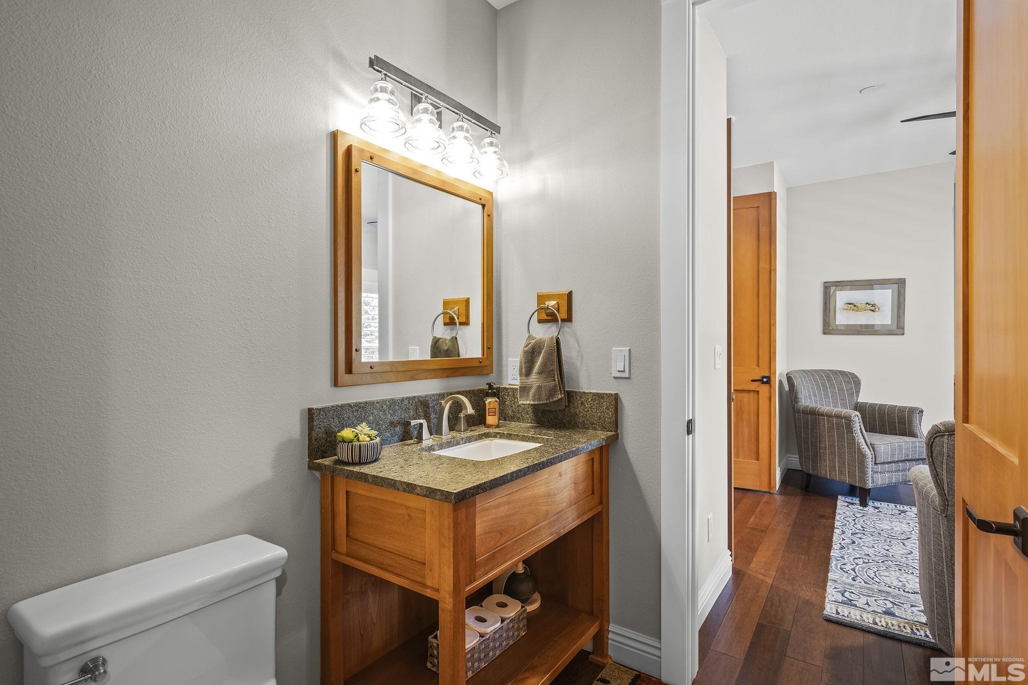 119 Five Creek Road Gardnerville, NV 89460 - Photo 19 of 40 a en suite bathroom with a granite countertop sink and a mirror