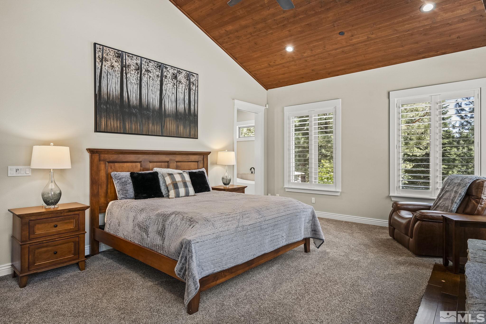 119 Five Creek Road Gardnerville, NV 89460 - Photo 20 of 40 a bedroom with a bed a couch and large window