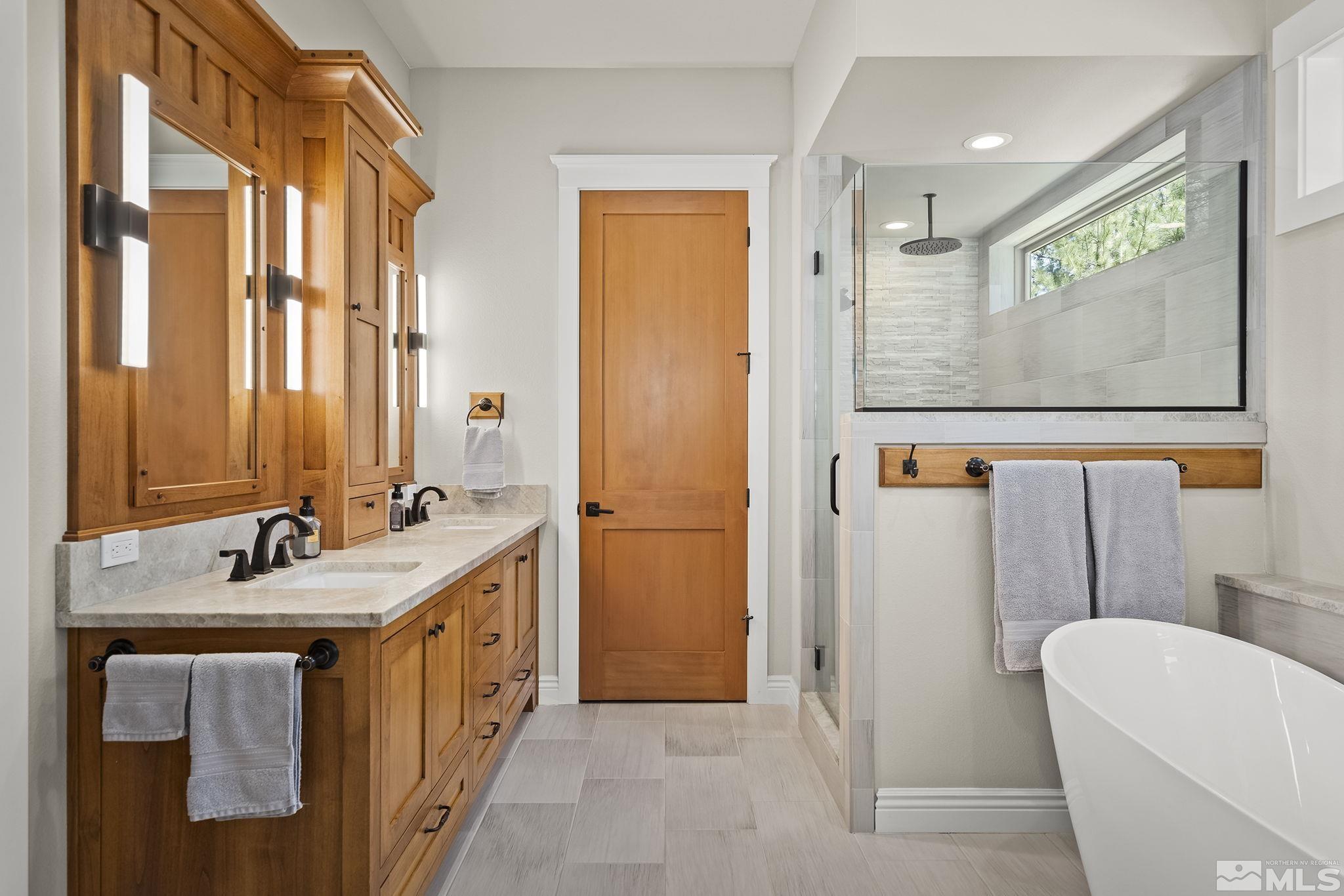 119 Five Creek Road Gardnerville, NV 89460 - Photo 22 of 40 a bathroom with a sink and a mirror