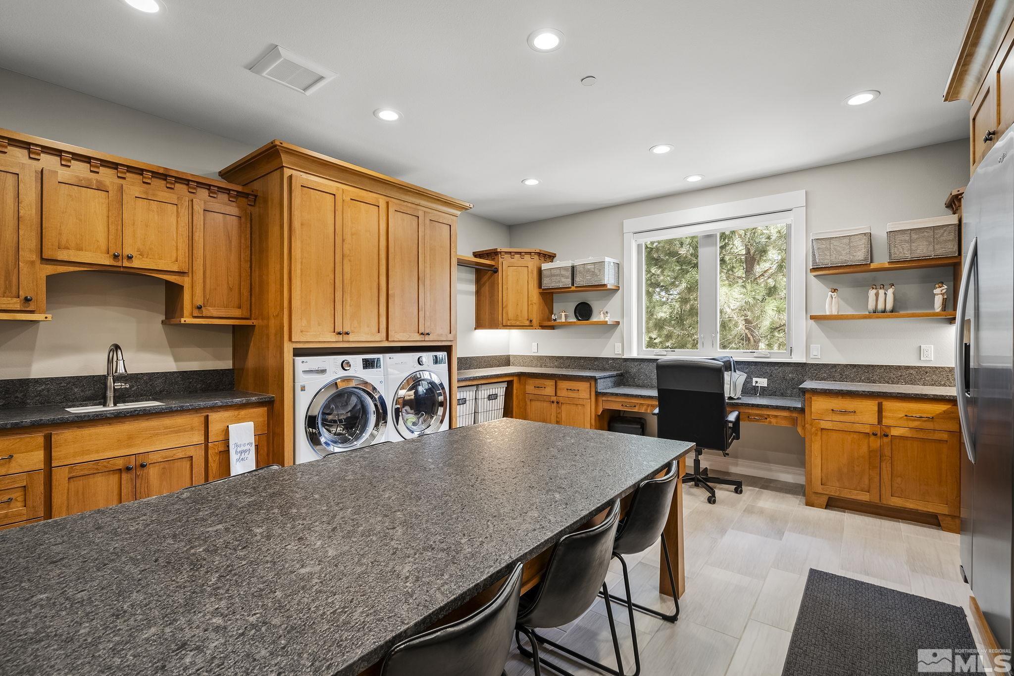 119 Five Creek Road Gardnerville, NV 89460 - Photo 24 of 40 a kitchen with stainless steel appliances granite countertop sink stove top oven and cabinets