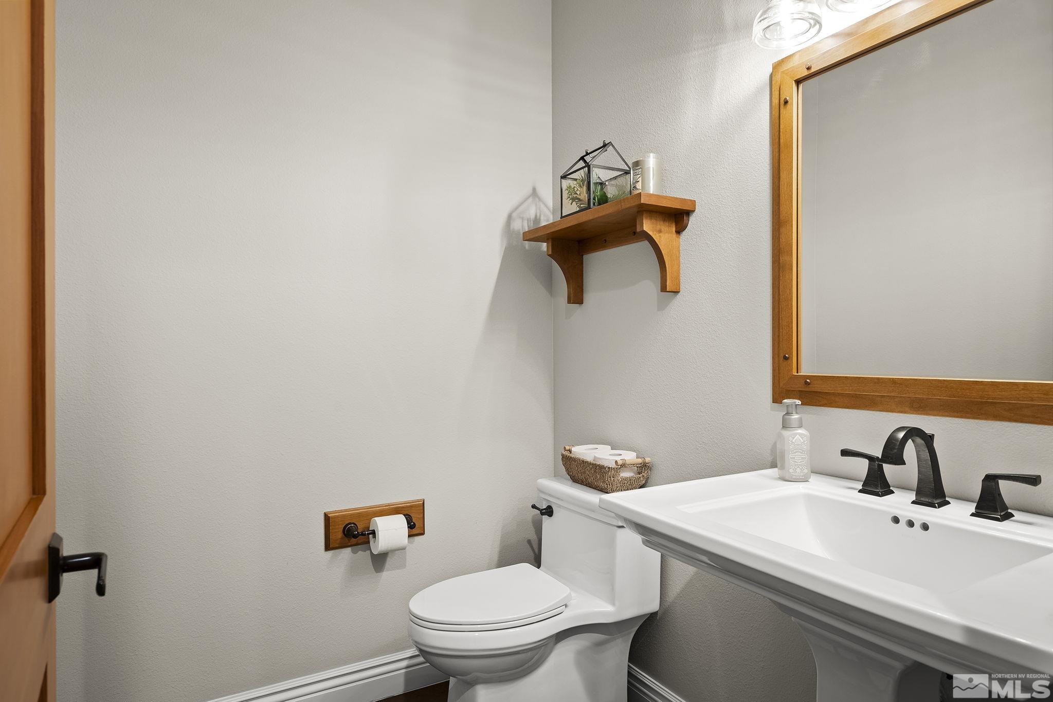 119 Five Creek Road Gardnerville, NV 89460 - Photo 26 of 40 a bathroom with a toilet sink and mirror