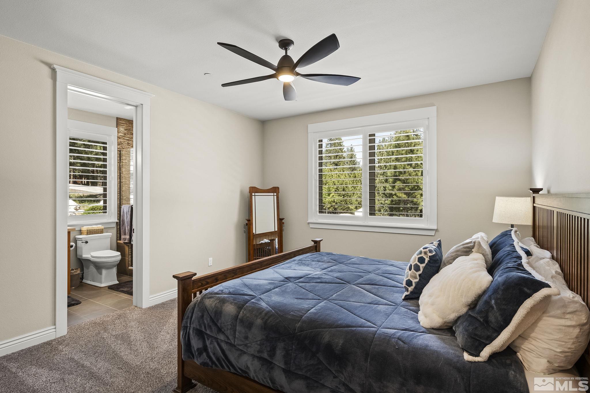 119 Five Creek Road Gardnerville, NV 89460 - Photo 29 of 40 a bedroom with a bed and a window