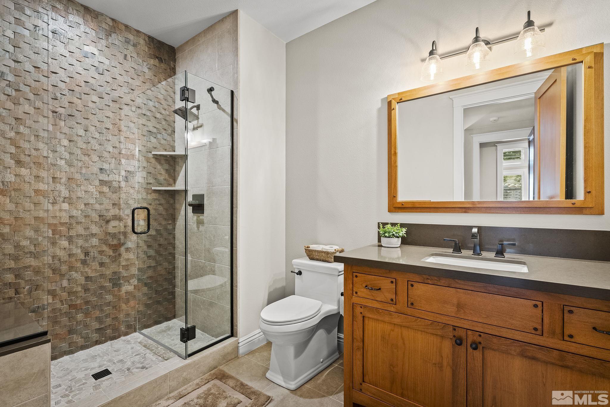 119 Five Creek Road Gardnerville, NV 89460 - Photo 32 of 40 a bathroom with a toilet sink shower and mirror