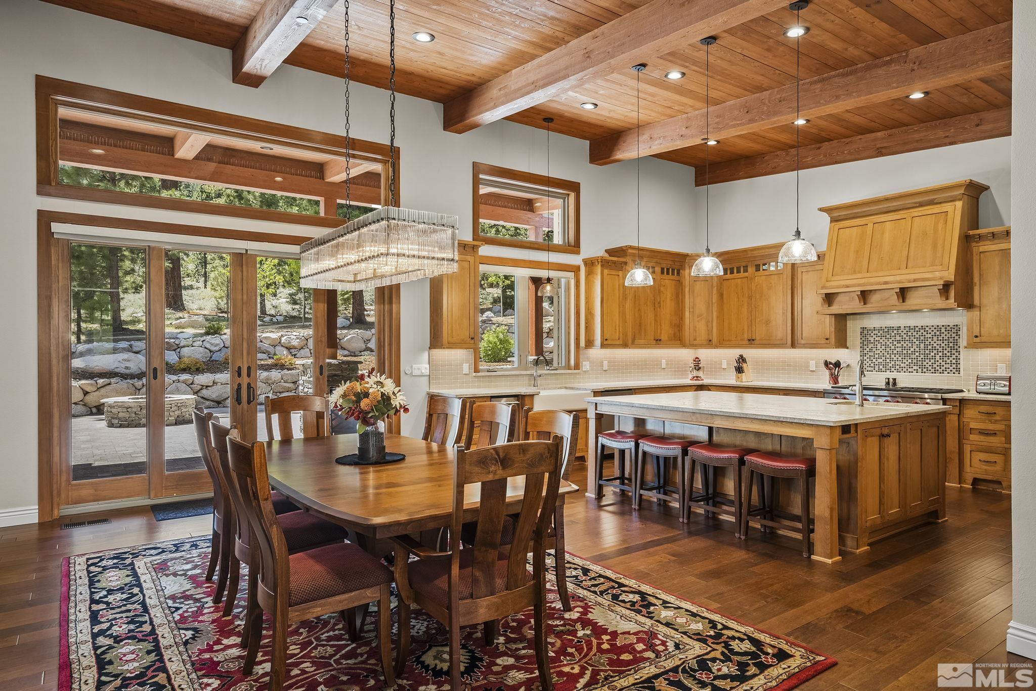 119 Five Creek Road Gardnerville, NV 89460 - Photo 10 of 40 a large dining space with furniture a chandelier and wooden floor