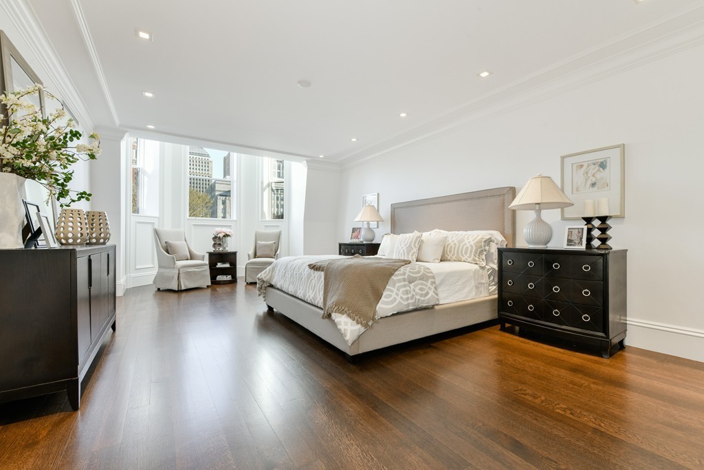 35 Commonwealth Avenue, Unit PH Boston, MA 02116 - Photo 12 of 25 a bedroom with a bed and a couch