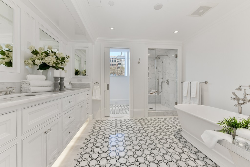 35 Commonwealth Avenue, Unit PH Boston, MA 02116 - Photo 14 of 25 a bathroom with a double vanity sink toilet and shower