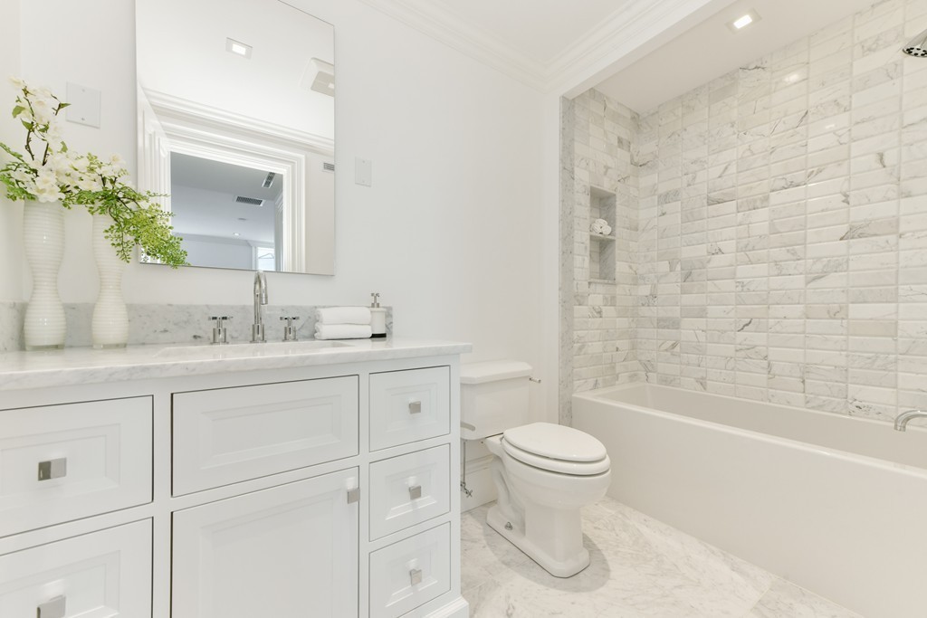 35 Commonwealth Avenue, Unit PH Boston, MA 02116 - Photo 18 of 25 a bathroom with a granite countertop sink a toilet and a bathtub