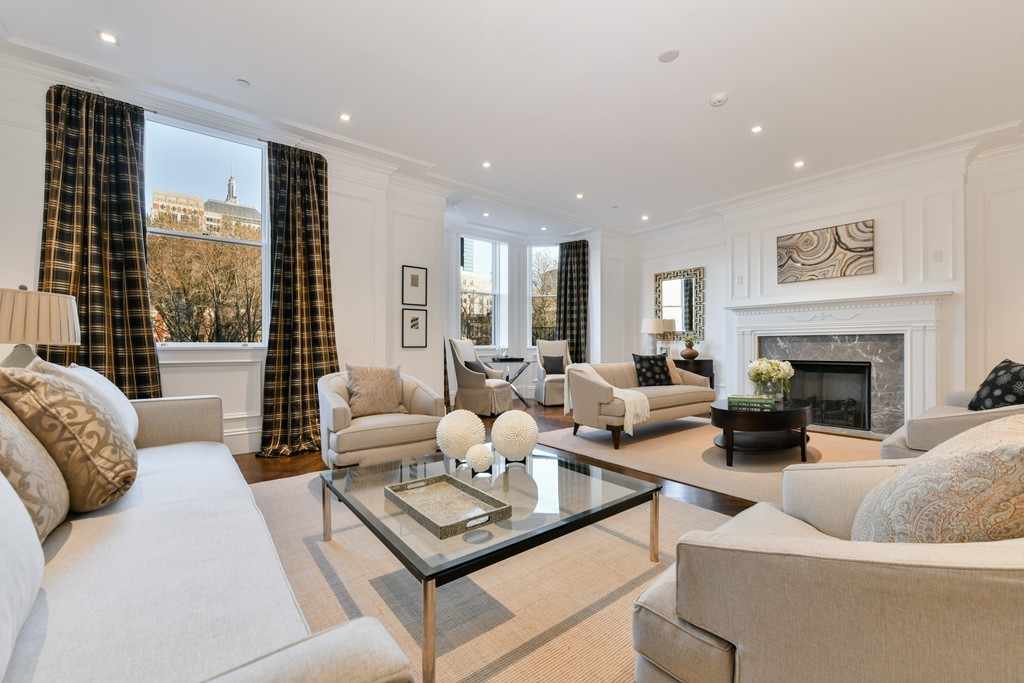 35 Commonwealth Avenue, Unit PH Boston, MA 02116 - Photo 2 of 25 a living room with furniture fireplace and a large window