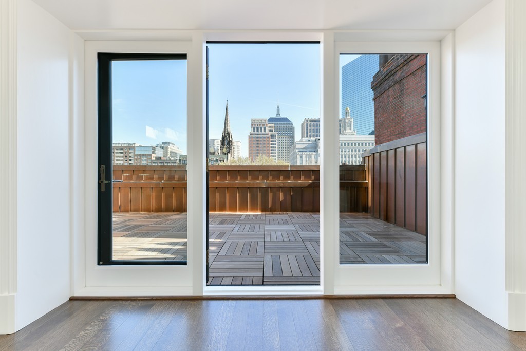 35 Commonwealth Avenue, Unit PH Boston, MA 02116 - Photo 22 of 25 a view of a room that has a large window