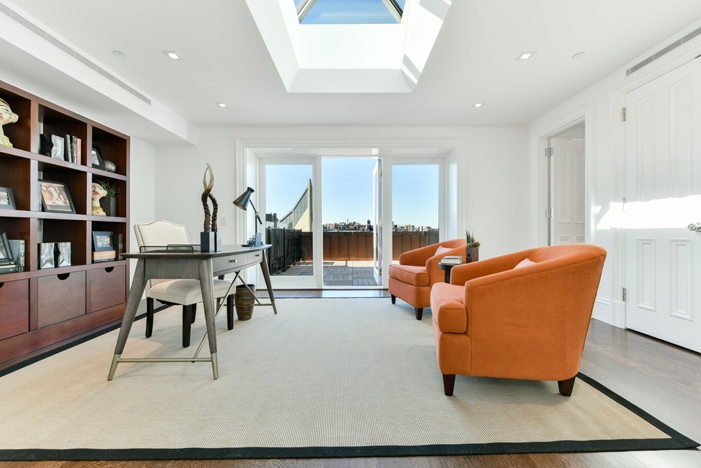 35 Commonwealth Avenue, Unit PH Boston, MA 02116 - Photo 24 of 25 a living room with furniture and a large window