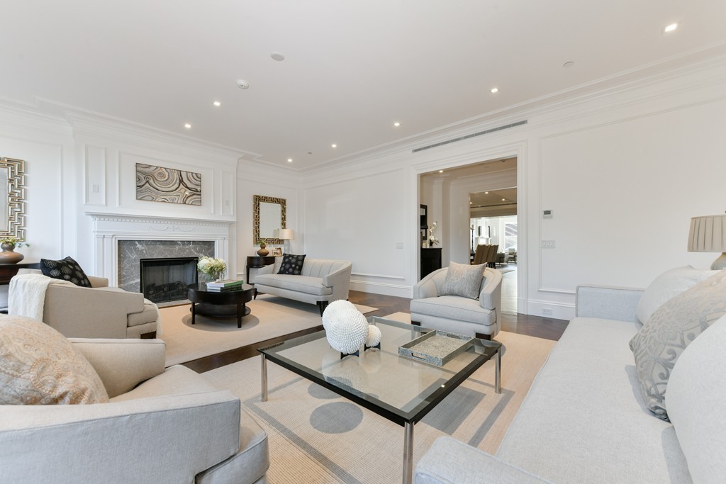35 Commonwealth Avenue, Unit PH Boston, MA 02116 - Photo 6 of 25 a living room with furniture and a fireplace