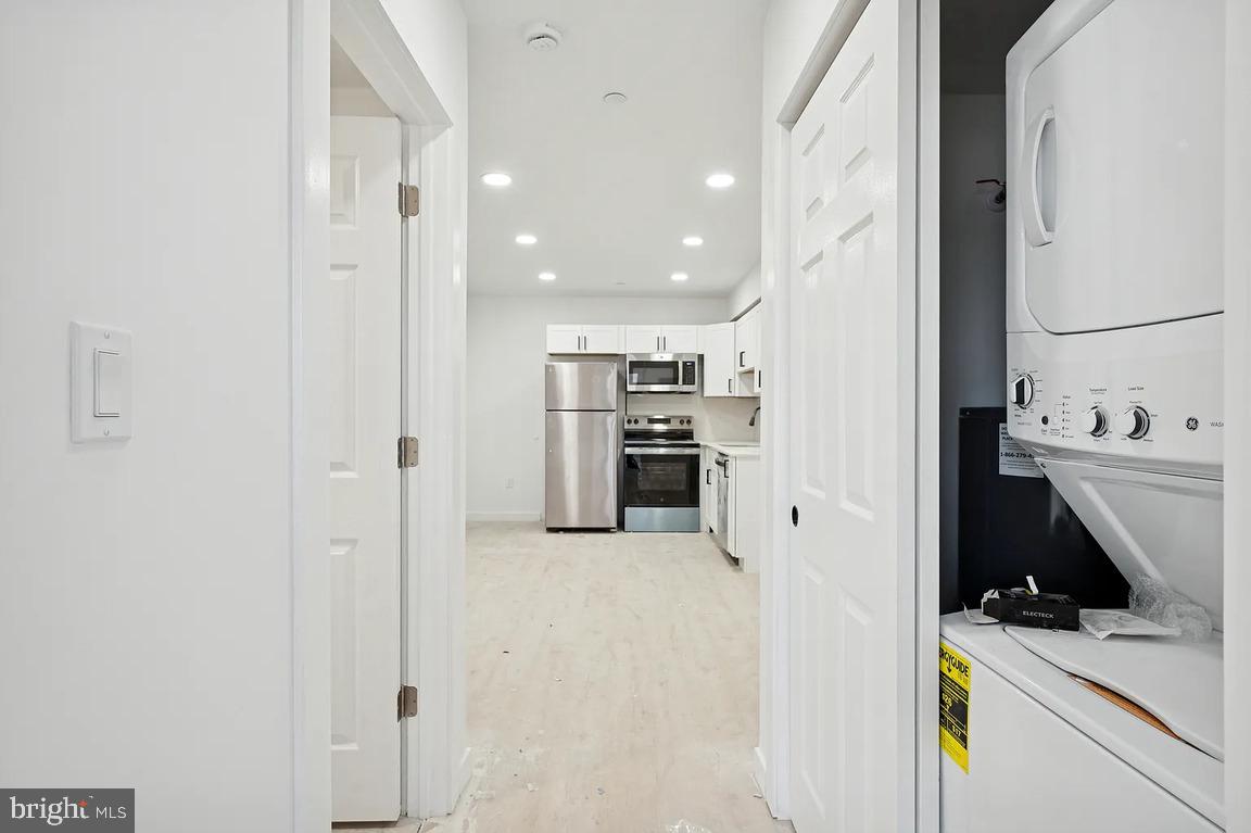 3413 North 19th Street, Unit 2F Philadelphia, PA 19140 - Photo 12 of 24 a view of a kitchen with a sink dishwasher stove and refrigerator