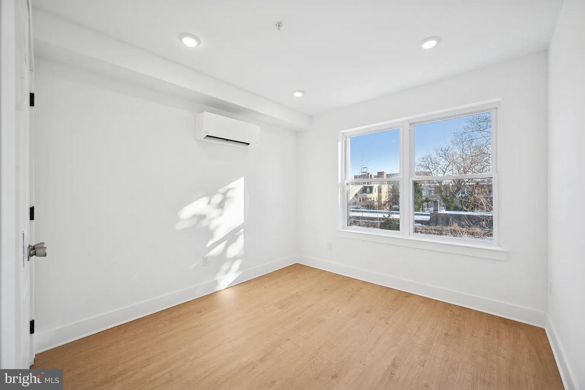 3413 North 19th Street, Unit 2F Philadelphia, PA 19140 - Photo 18 of 24 an empty room with windows