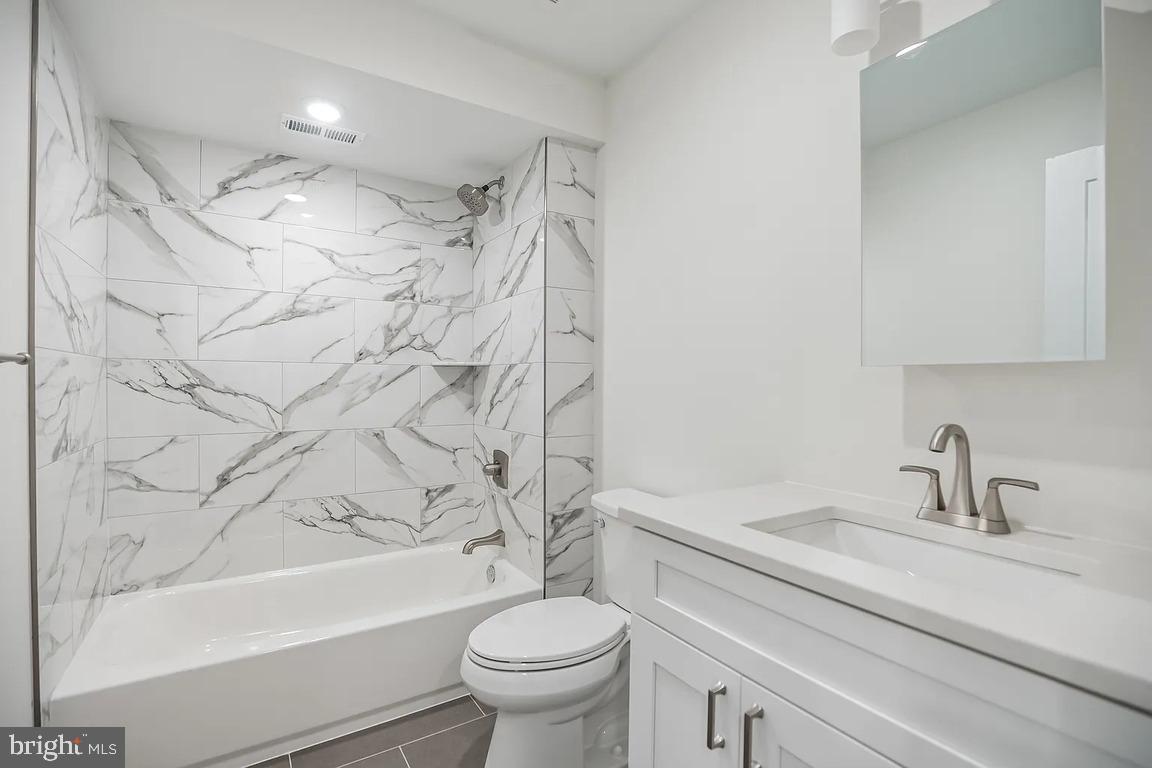 3413 North 19th Street, Unit 2F Philadelphia, PA 19140 - Photo 23 of 24 a bathroom with a sink toilet and shower