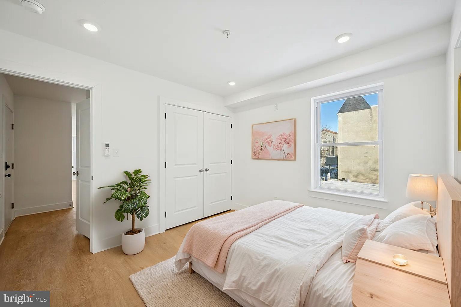 3413 North 19th Street, Unit 2F Philadelphia, PA 19140 - Photo 5 of 24 a bedroom with a bed and potted plant