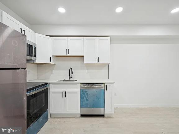 3413 North 19th Street, Unit 2F Philadelphia, PA 19140 - Photo 7 of 24 a kitchen with stainless steel appliances granite countertop a stove and a refrigerator