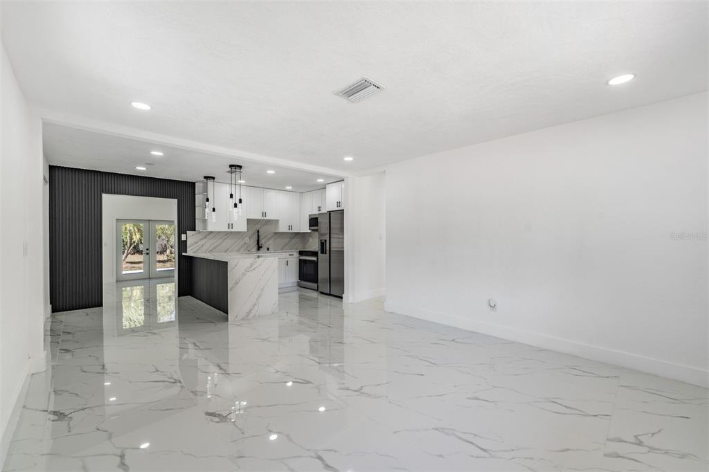 1413 May Street Lutz, FL 33548 - Photo 4 of 21 a view of kitchen with kitchen island a sink appliances and a counter top space