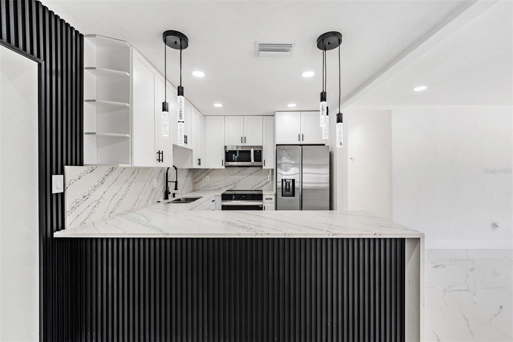 1413 May Street Lutz, FL 33548 - Photo 6 of 21 a kitchen with refrigerator and window