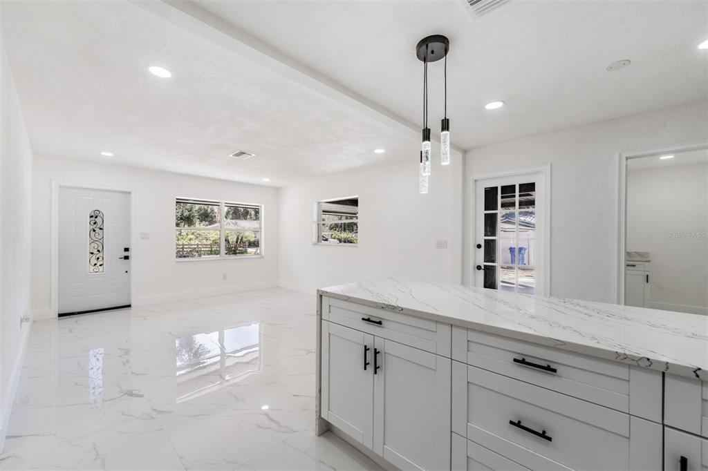 1413 May Street Lutz, FL 33548 - Photo 9 of 21 a spacious bathroom with a granite countertop sink a mirror and shower