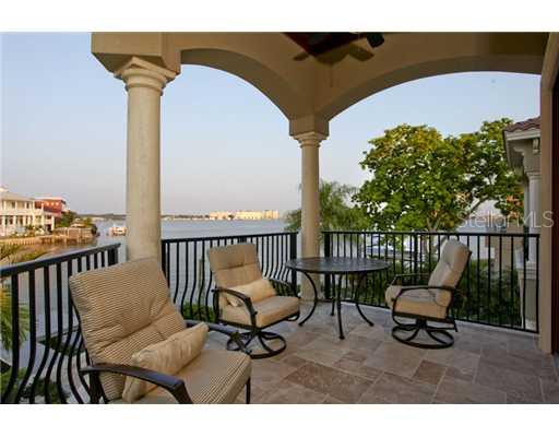 16005 4th Street East Redington Beach, FL 33708 - Photo 8 of 12 Master Bedroom - Private, covered, master suite balcony features travertine floors, cypress ceilings and breathtaking views of the intracoastal waterway.