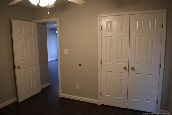 an empty room with closet area