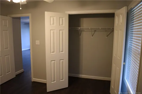 an empty room with wooden floor