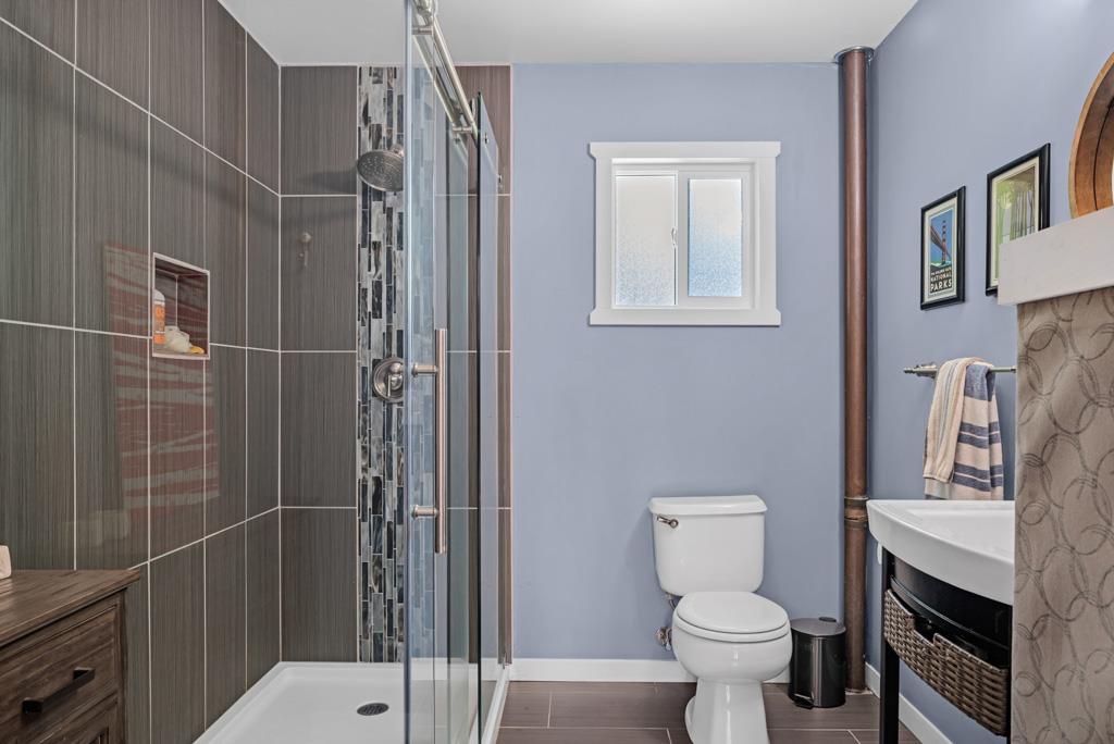 1753 Lightning Lane Arnold, CA 95223 - Photo 15 of 46 a bathroom with a toilet sink and shower