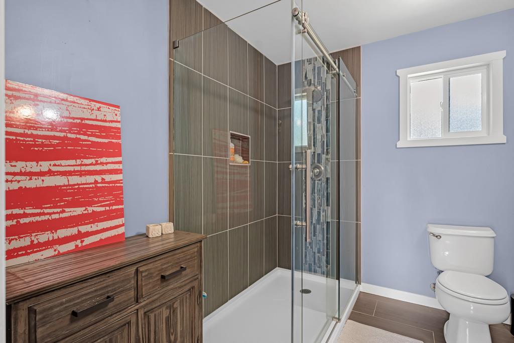 1753 Lightning Lane Arnold, CA 95223 - Photo 16 of 46 a bathroom with a sink a toilet and shower