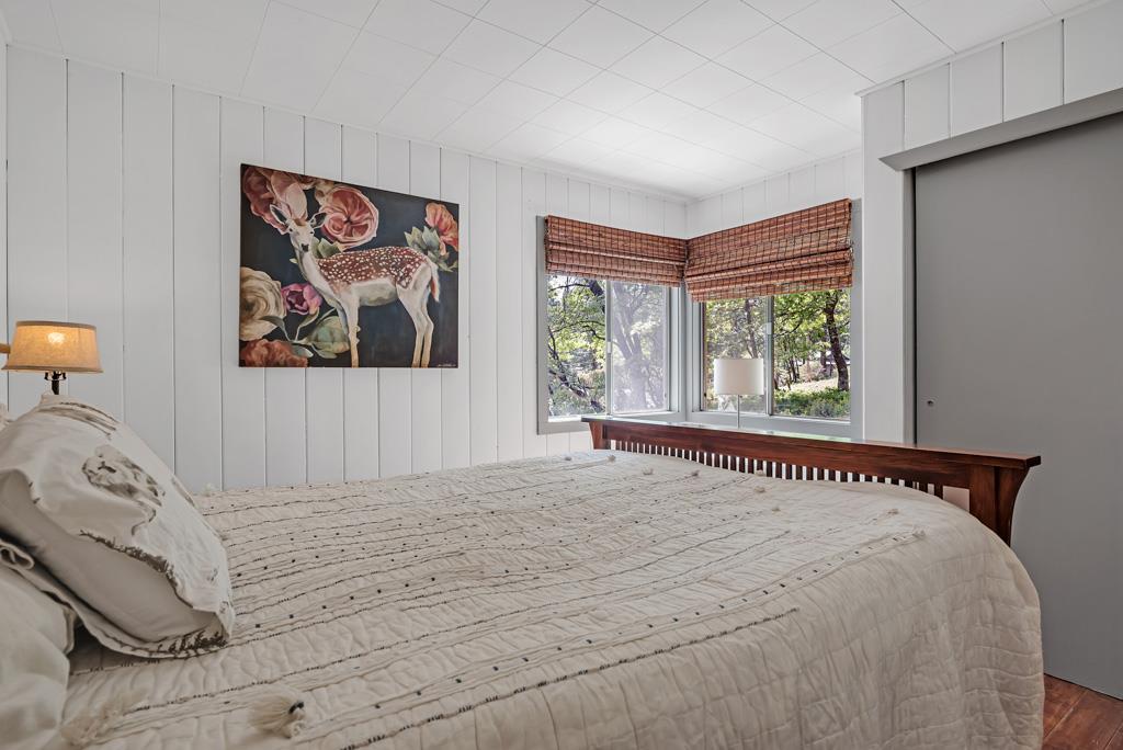 1753 Lightning Lane Arnold, CA 95223 - Photo 19 of 46 a bedroom with a bed and a painting on the wall