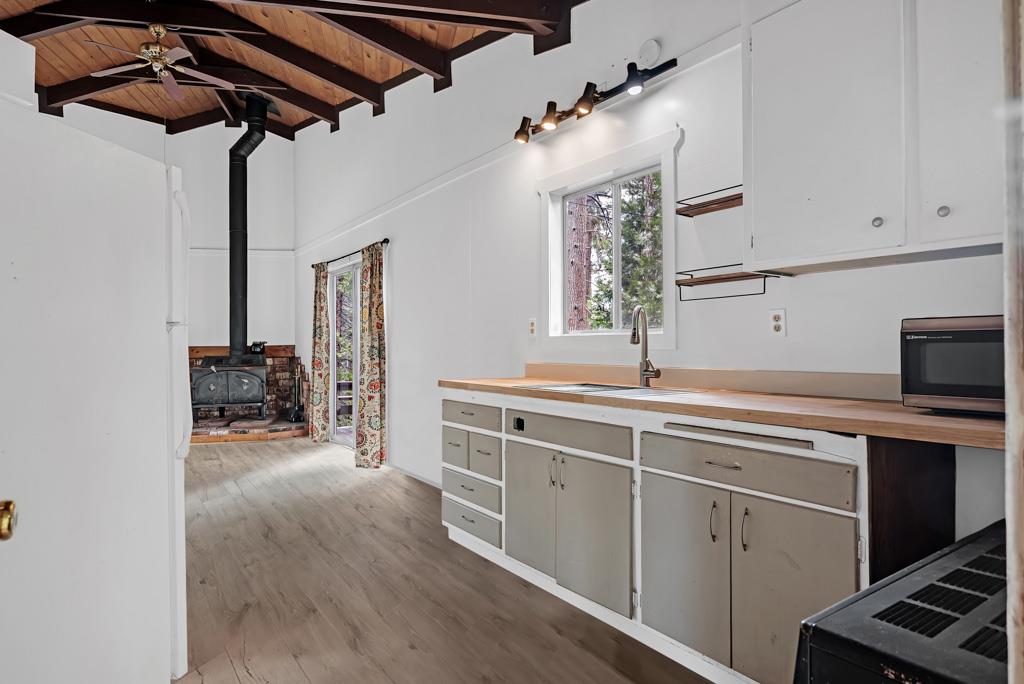 1753 Lightning Lane Arnold, CA 95223 - Photo 30 of 46 a kitchen with stainless steel appliances granite countertop a sink and cabinets
