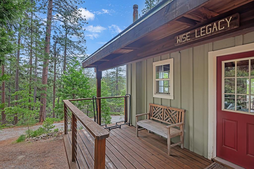 1753 Lightning Lane Arnold, CA 95223 - Photo 6 of 46 a view of a balcony with wooden floor and bench