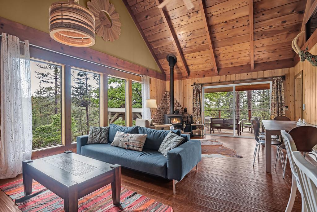 1753 Lightning Lane Arnold, CA 95223 - Photo 7 of 46 a living room with furniture and floor to ceiling windows