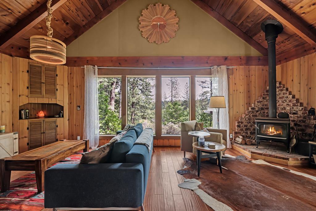 1753 Lightning Lane Arnold, CA 95223 - Photo 10 of 46 a living room with furniture and a floor to ceiling window