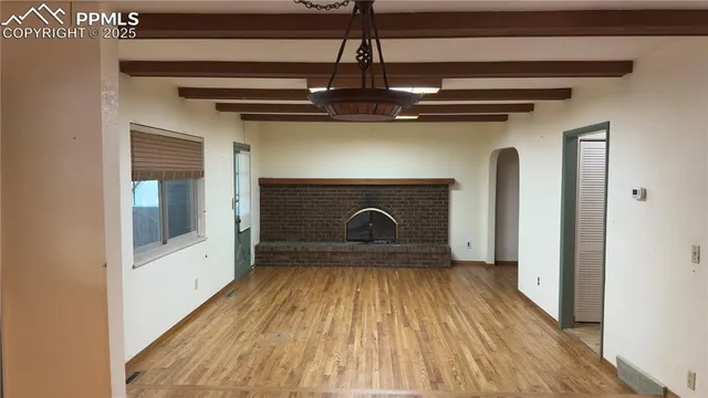 a view of fireplace and wooden floor