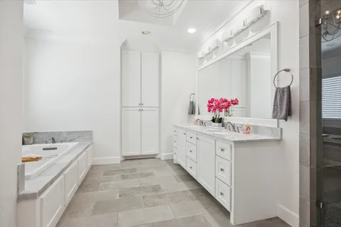 a bathroom with a sink vanity and mirror