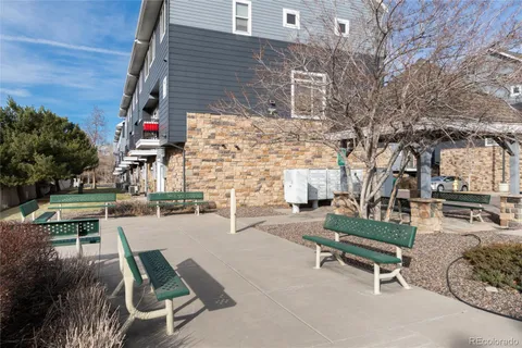 a view of backyard with outdoor seating and trees