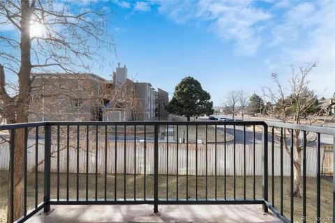 a view of a balcony with a pot