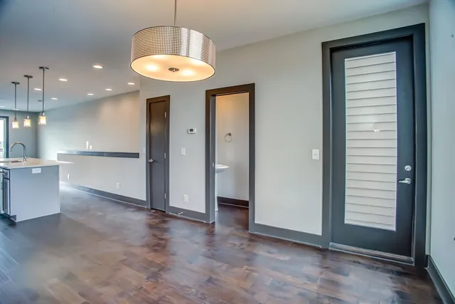 a view of a kitchen with a sink and a window