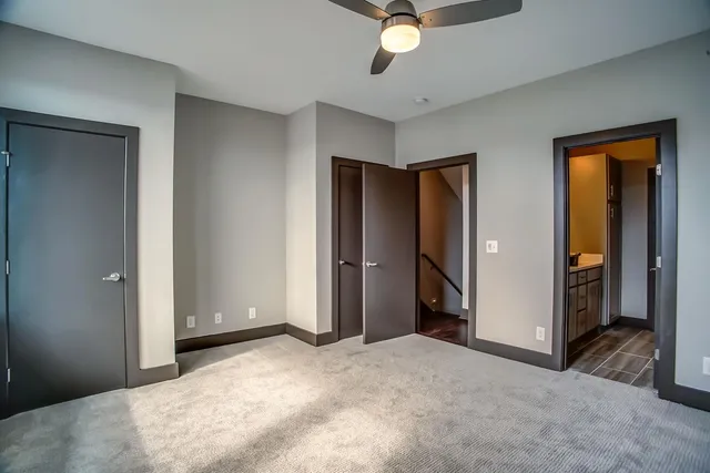 an empty room with wooden floor and a window