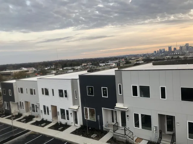 a view of a white building among the street