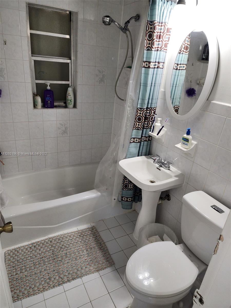 Tropical Estates Miami, FL 33165 - Photo 16 of 31 a bathroom with a toilet sink and shower