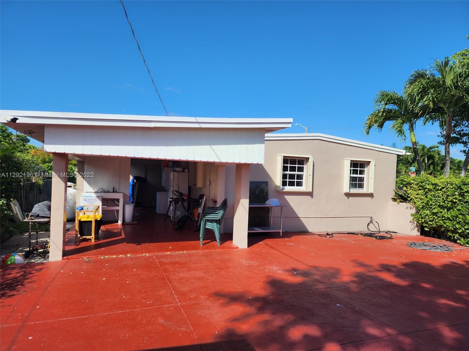 Tropical Estates Miami, FL 33165 - Photo 22 of 31 a view of a house with basket ball court and a garage
