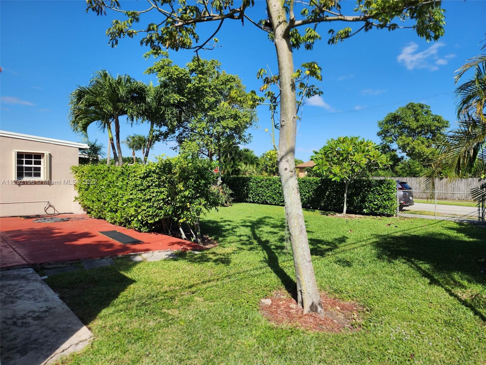 Tropical Estates Miami, FL 33165 - Photo 23 of 31 a view of a yard in front of house