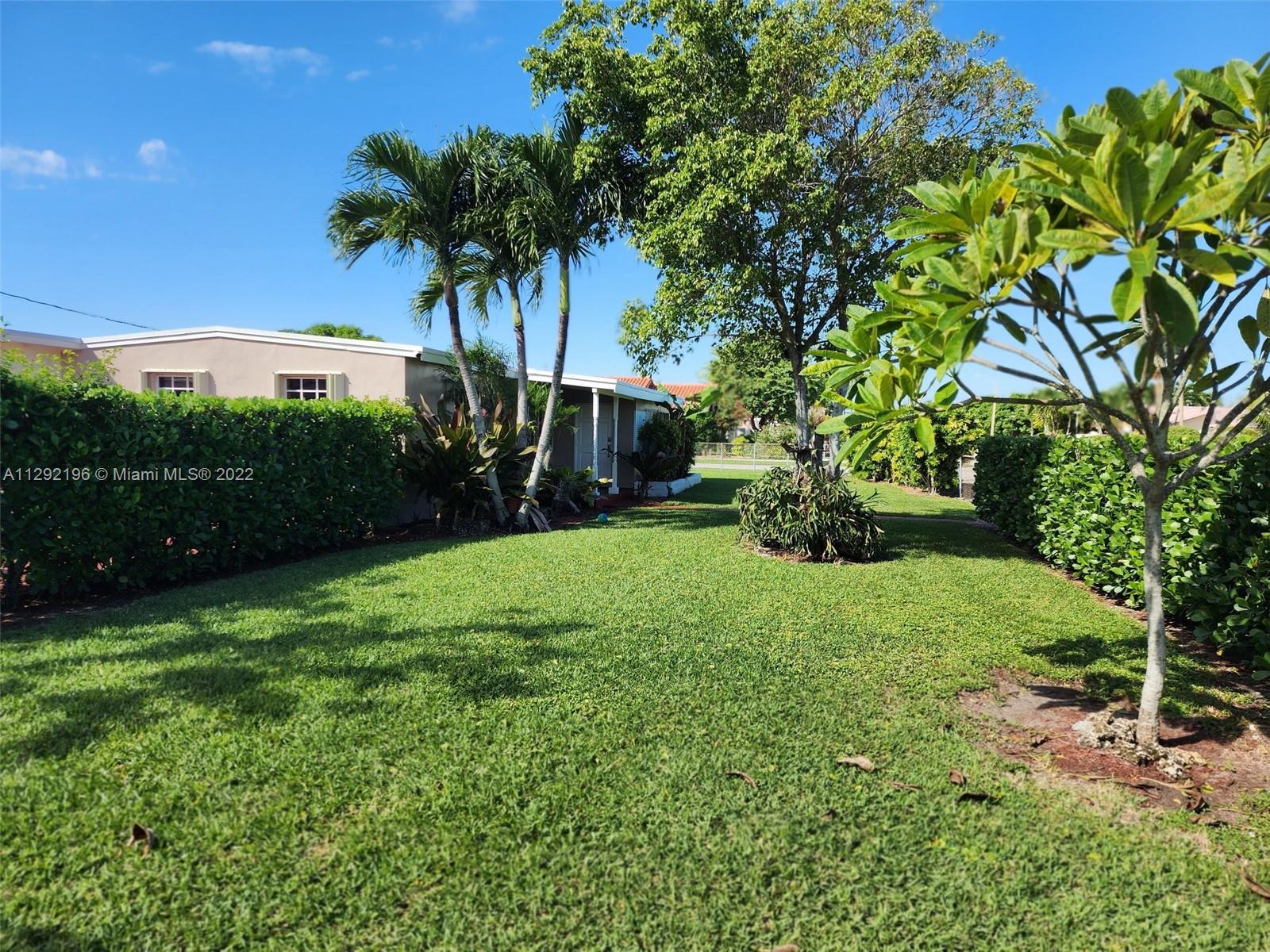 Tropical Estates Miami, FL 33165 - Photo 25 of 31 a view of a garden with a tree